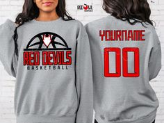 Personalized Red Devils School Spirit T-Shirt Crewneck, Hoodie Hooded Sweatshirt Football, Baseball, Basketball, Softball, Track, Volleyball, Cross Country, Cheer, Wrestling Not all colors are available in all sizes and styles.  Please check the color and size charts in photos. We do our best to accurately represent shirt colors by using actual photos but do understand that all monitors will display differently. Please contact us prior to purchase with any questions on sizing or colors. Your purchase includes a custom imprint created specifically for your team! A product proof will be emailed to you within 1 business day.  Please keep an eye on your Etsy messages and reply with any changes within 24 hours. Your order will be sent to production after that time if no response is received. Ex Red Graphic Sweatshirt For Sports Events, Red Graphic Print Sweatshirt For Sports Events, Red Crew Neck Sweatshirt For Fan Merchandise, Red Crew Neck Sweatshirt For Fans, Red Crew Neck Sweatshirt For Sports Events, Red Sweatshirt For Sports Events With Team Name, Red Tops With Custom Print For Sports Events, Red Custom Print Fan Apparel Top, Red Custom Print Crew Neck Top