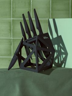 a sculpture made out of black plastic on top of a table