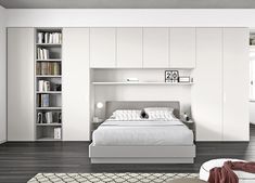 a bedroom with white furniture and bookshelves on the wall, along with a bed