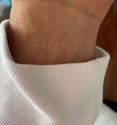 a woman's wrist with the word cinema written on her left arm and hand