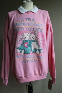 --Vintage deadstock pink collared Jerzees sweatshirt with a 'True Friend' graphic on front. --"A true friend knows who you are but likes you anyway." --Printed cross stitch-style graphic. --Size Large (42-44). --New with tags. --50% cotton, 50% Dacron polyester. Measurements (lying flat): Bust (pit to pit): 21" Raglan sleeve (neckline to cuff): 32" Length (back of neck to hem): 26.5" Pink Collars, Know Who You Are, True Friends, Raglan Sleeve, Graphic Sweatshirt, Sweatshirts, Pink