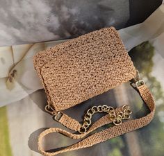 👜 Introducing our chic Crossbody Raffia Bag, a must-have accessory that combines style and functionality with a touch of natural charm. Handcrafted with precision, this bag is designed to elevate your outfit while keeping your essentials close at hand. ✅ The lightweight and breathable raffia material brings a fresh and summery vibe to this crossbody bag. Its natural texture and woven design add a unique and artisanal touch, making it a standout piece in your collection. ✅ With its convenient crossbody style, this bag offers hands-free convenience, allowing you to move freely and comfortably throughout your day. ✅ The compact yet spacious interior of the bag provides just the right amount of space to carry your essentials, such as your phone, wallet, keys, and a few small personal items. Chic Straw Satchel With Mobile Phone Bag, Chic Straw Satchel Bag With Phone Holder, Chic Straw Crossbody Bag With Phone Holder, Chic Natural Straw Bag With Mobile Phone Pocket, Trendy Woven Clutch Shoulder Bag, Beige Clutch Shoulder Bag With Braided Handles, Elegant Crossbody Straw Bag For Everyday Use, Natural Color Clutch Shoulder Bag With Detachable Strap, Beige Shoulder Clutch Bag With Braided Handles