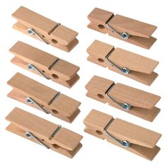 six wooden clothes pegs with metal clips on white background, set of 6 pieces