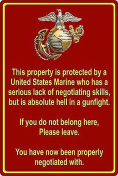 a red and yellow sign with the words, this property is protected by a united states marine who has a serious lack of negotiating skills