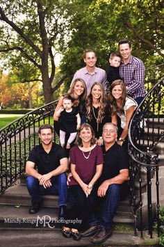 a family posing for a photo on the steps