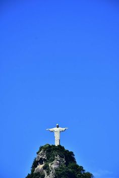 the statue of christ stands on top of a hill in rio cristo, brazil