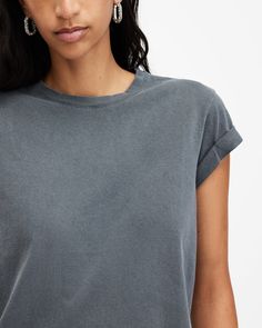 An easy piece, this is the Anna T-Shirt. Crafted from soft organic cotton, it's shaped to a slim silhouette. Featuring turned-up cuffs and our AllSaints signature on the back of the neck. We keep this staple on rotation all year round - make it part of your collection.   This t-shirt is designed to a slim fit Pullover Crew neck Short sleeve Turned up cuffs AllSaints signature logo Allsaints Short Sleeve Tops With Relaxed Fit, Allsaints Relaxed Fit Short Sleeve Tops, Basic Washed Organic Cotton Tops, Classic Tops With Rolled Sleeves In Relaxed Fit, Allsaints Casual Crew Neck Top, Crew Neck Organic Cotton Washed Tops, Organic Cotton Washed Crew Neck Top, Washed Organic Cotton Crew Neck Top, Summer Cotton Tops By Allsaints