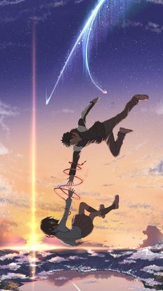 two people flying through the air while holding onto each other's legs in front of a sunset