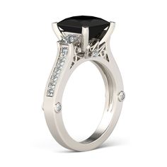 a white gold engagement ring with an oval cut black diamond and side stones on the band