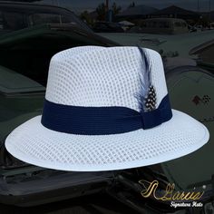 Handmade with the highest quality materials of 100% cotton string Style: Classic Viejo Fedora Color: White Hat Band: Navy Feathers: Rooster Brand: Garcia Signature Hats All sales are final Social Media Facebook @garciasignaturehats Instagram @garciasignaturehats White Fitted Hat Bands For The Beach, White Fitted Hat Band For Beach, White Flat Bill Panama Hat For Beach, White Flat Bill Fedora For Kentucky Derby, White Flat Bill Straw Hat For Summer, White Sun Hat With Flat Bill For Beach, White Flat Bill Sun Hat For The Beach, White Flat Bill Sun Hat For Beach, White Adjustable Flat Bill Straw Hat