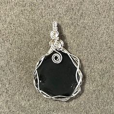 Couldn’t wait to design this Rare charcoal gray sea glass that I found on the beach this morning! Soon to be added to my etsy shop. If you are interested in it before I get it in my shop, message me.#seaglassnecklace Silver Teardrop Sea Glass Jewelry, Minimalist Silver Sea Glass Necklace, Handmade Green Sea Glass Necklace, Silver Sea Glass Necklace With Wire Wrapped Detail, Handmade Ocean-inspired Sea Glass Necklaces, Adjustable Ocean-inspired Sea Glass Jewelry, Silver Gift Box, Sea Glass Pendant, Green Sea