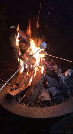 a campfire is lit with bright flames