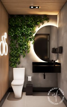 a bathroom with a toilet, mirror and plant on the wall