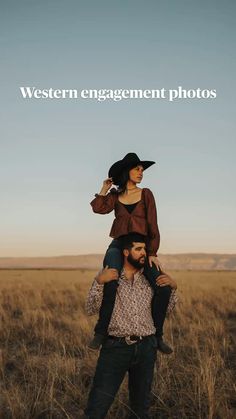 a man carrying a woman on his back in the middle of an open field with tall grass