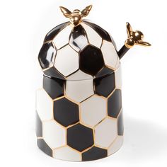 PRICES MAY VARY. BEE HIVE HONEY-POT JAR: Give any corner of your home MacKenzie-Childs flair! Our ceramic Queen Bee Honey Pot serves honey in style. This chic piece of creative storage has a matching lid and honey wand that makes it the perfect honey jar for a coffee, tea, or dessert bar. ELEGANT KITCHEN ESSENTIALS: Our ceramic bee-hive honey dispenser brings sweet style to your table. Decorated in a modern black-and-white hive pattern, it’s trimmed with gold luster and embellished with buzz-wor Ceramic Honey Pot, Bee Kitchen, Pot Image, Bee Honey, Bee Inspired, Honeycomb Pattern, Honey Pot, Mackenzie Childs, Monogrammed Items