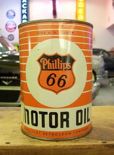 an old phillips motor oil can sitting on a table