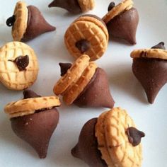 some cookies and pastries are arranged in the shape of star wars characters on a white surface