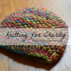 a knitted hat sitting on top of a wooden table