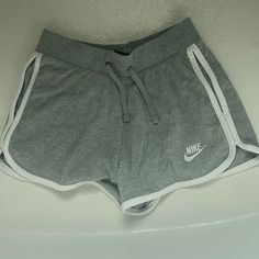 Grey Nike Sweatshorts Size Xs Never Worn White Leisure Shorts, White Sportswear Shorts For Leisure, Sporty White Leisure Shorts, Sporty White Pajama Shorts, Sporty Gray Athletic Shorts For Spring, White Nike Shorts With Pockets, White Athletic Sportswear Shorts, Gray Athleisure Shorts For Spring, Athleisure Gray Shorts For Spring