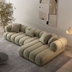 a large sectional sofa sitting on top of a rug