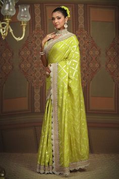 Lemon green floral jaal chanderi saree, embellished with intricate gota, dori and badla work and purple border. Comes with silk chanderi padded blouse with scalloped neckline. - Aza Fashions Pista Green Zari Weaving Blouse Piece For Designer Wear, Designer Green Pre-draped Saree With Meenakari, Raw Silk Meenakari Saree For Reception, Reception Meenakari Raw Silk Saree, Meenakari Raw Silk Saree For Reception, Pista Green Saree With Meenakari For Eid, Pista Green Gota Work Dola Silk Saree, Pista Green Dola Silk Saree With Gota Work, Green Banarasi Silk Traditional Wear For Reception