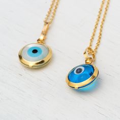 Tiny 14k solid gold round evil eye pendant. Dainty pendant. Great for everyday wear. Available with a solid 14k gold chain or as pendant only. The evil eye pendant is available in yellow gold and white gold with a blue eye and in yellow gold with a white eye. The blue eye is made of glass and the white eye of mother of pearl (mop). Chains are available in 3 lengths, 16inches/40cm, 18inches/45cm and 20 inches/50cm The pendant measures about 8mm / 1/3 inch (without the loop). Perfect gift for Vale 14k Gold Round Evil Eye Charm Necklace, 14k Gold Charm Necklace With Evil Eye, 14k Gold Evil Eye Charm Necklace With Round Pendant, Yellow Gold Evil Eye Charm Necklace, Evil Eye Charm Necklace With Round Pendant, Forever Necklace, Rose Gold Gifts, Minimal Necklace, Mangalsutra Designs