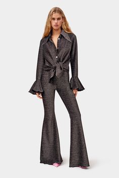 Luxury Relaxed Fit Bottoms With Pressed Crease, Elegant Black Pants With Flared Hem, Elegant Black Flares For Night Out, Elegant Black Flares For Party, Elegant Black Flares For Evening, Black Elegant Evening Flares, Elegant Black Evening Flares, Black Flared Hem Pants For Party, Elegant Fitted Pants With Flared Cuffs