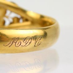 A very fine Victorian gold filled bangle bracelet.  Made by the W. & S. Blackinton Co. of Meriden, CT in the late 19th century.  The center is bezel set with an emerald-cut purple glass stone and surrounded with gold filled leaf work.    The veined leaves are bunched in groups, and each group itself has a very small purple glass stone set at its center.  It is engraved to the reverse with a period monogram MDC.  A wonderfully sophisticated Victorian era bracelet!  Date: Late 19th Century or Earl Victorian Gold Engraved Collectible Ring, Victorian Gold Engraved Ring, Victorian Style Gold Engraved Ring, Antique Gold 14k Stamped Jewelry For Wedding, Victorian Bracelets For Anniversary, Ceremonial Yellow Gold Jewelry With Hallmarks, Vintage Gold Jewelry With Bezel Setting, Victorian Jewelry For Wedding With Hallmarks, Gold Engraved Ring With Bezel Setting For Wedding