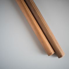 two chopsticks laying next to each other on top of a white countertop