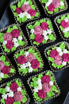 cupcakes with pink and green frosting are arranged in the shape of flowers