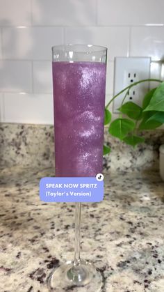 a purple drink sitting on top of a counter