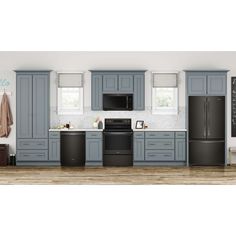 a kitchen with gray cabinets and black appliances