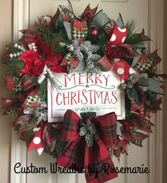 a christmas wreath hanging on the front door