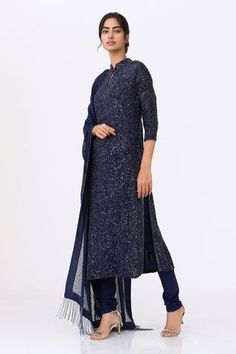 Navy blue long kurta highlighted with sequin embroidery, mandarin collar and straight silhouette. Comes with churidar and dupatta.
Component: 3
Embroidered
Neckline: Mandarin Collar
Sleeve Length: Three Quarter
Fabric: Chiffon
Color: Blue
Straight kurta
Keyhole mandarin collar
Embroidered dupatta with beaded tassels - Aza Fashions Chiffon Embroidery, Kurta Set For Men, Long Kurta, Kurta Set For Women, Sequin Embroidery, Embroidered Dupatta, Straight Kurta, Embroidered Neckline, Sequins Embroidery