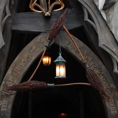 the entrance to hogwarts castle is decorated with brooms and light bulbs hanging from it's ceiling