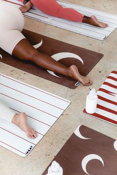 two women are doing yoga on their mats