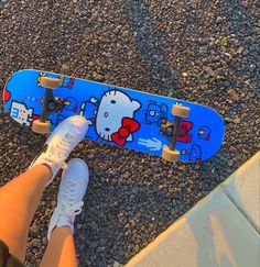 someone is standing on the ground with their skateboard