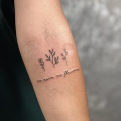 a woman's arm with flowers and the words, no matter what she means