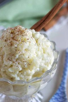 a bowl filled with mashed potatoes on top of a table