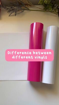 two rolls of pink and white vinyl sitting next to each other on top of a table