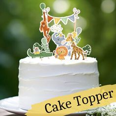 a cake topper with animals and giraffes on it