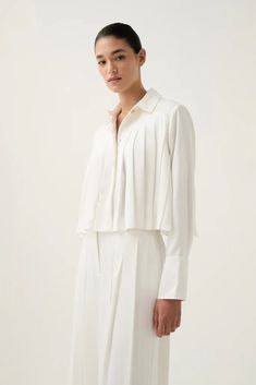 Estrade Pleated Crop Shirt | Ivory | Aje – Aje ROW Jumper Denim, Jumper Pants, Knit Jumpsuit, Denim Accessories, Gold Accent, White Maxi Dresses, Floral Dress Black, Crop Shirt, Shirt Collar