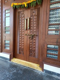 two wooden doors with decorative decorations on them