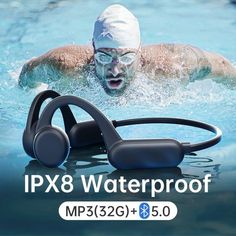 an image of a man swimming in the water with headphones