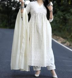 COTTON CHIKANKARI KURTI PANT WITH DUPATTA SET New Pure Cotton chickenKari emb nyra cut kurti ( lineing attached) with cotton pant with mirror emb lace. chandri dupptta with bijya lace. Colour: off white Kurti length 47 Sleeves : 3/4 Sleeves Neckline : Deep -V neck Size : S To XXL (36 to 44) Care- HAND WASH We are an Manufacturer all Women Dresses. We are also work in any type of Personalisation items. Safety - 100% Sanitized, Instructions: Machine Wash / Hand Wash This Fabric Makes This Kurti Pa Chikankari Palazzo, Aesthetic White Dress, White Salwar Suit, Kurti Pant With Dupatta, Chikankari Kurti, Kurti Pant, Simple Kurti Designs, Stylish Short Dresses