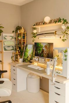 a home office with plants on the wall and shelves above it, along with a computer desk