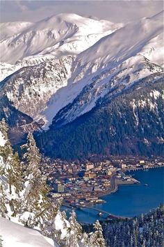 an aerial view of a snowy mountain town