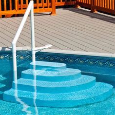 an above ground swimming pool with steps leading up to it