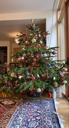 a decorated christmas tree in a living room