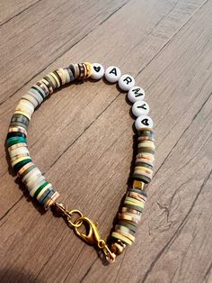 Hand made by fourth grade friends.Letter beads that say army with two black hearts camouflage colors with cubed gold accent beads. Finished with a lobster claw clasp. Wear it on its own or with a bracelet stack. Army Clay Bead Bracelet, Camo Clay Bead Bracelet, Army Bracelets, Green Clay Bead Bracelet, Friends Letter, College Jewelry, Clay Bead Necklace, Clay Bracelets, Clay Bead Bracelet